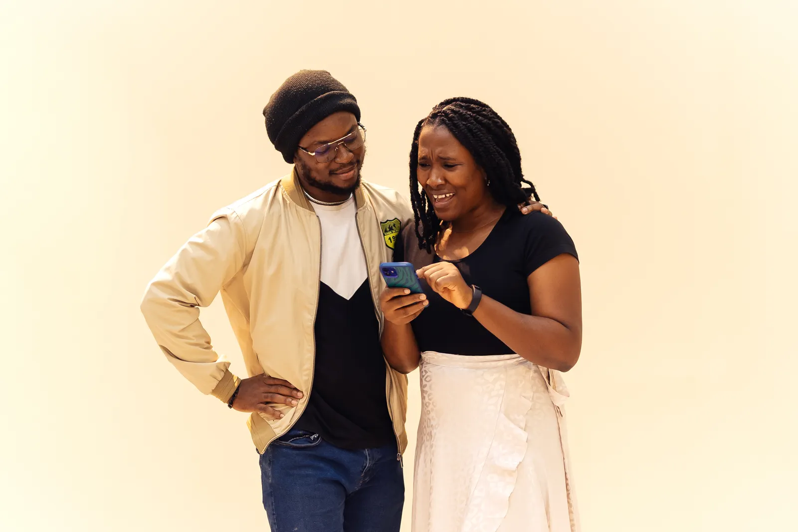 People using a smartphone in a real-life setting related to Ajo 2.0