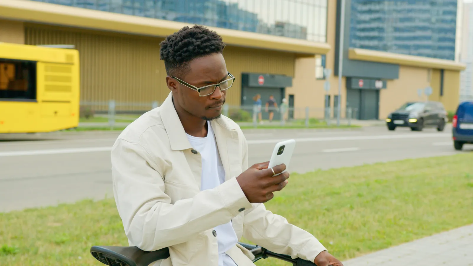 People using a smartphone in a real-life setting related to Voice Banking