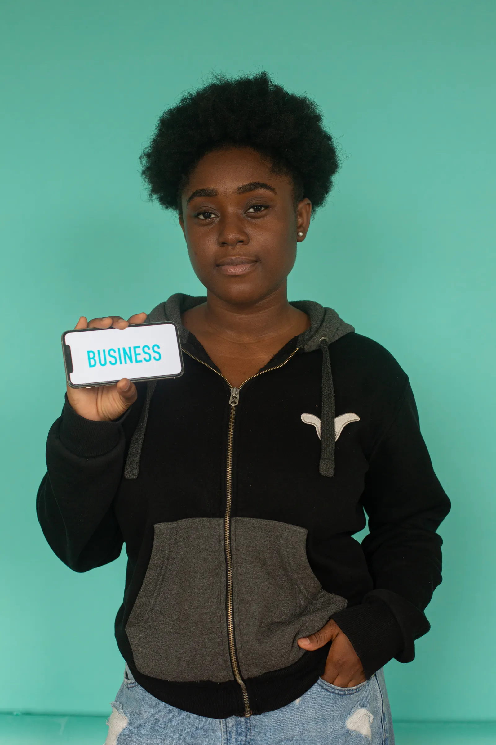 A woman reviewing information on her smartphone